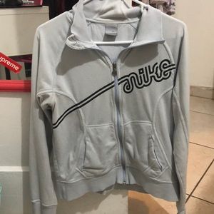very light blue nike jacket.